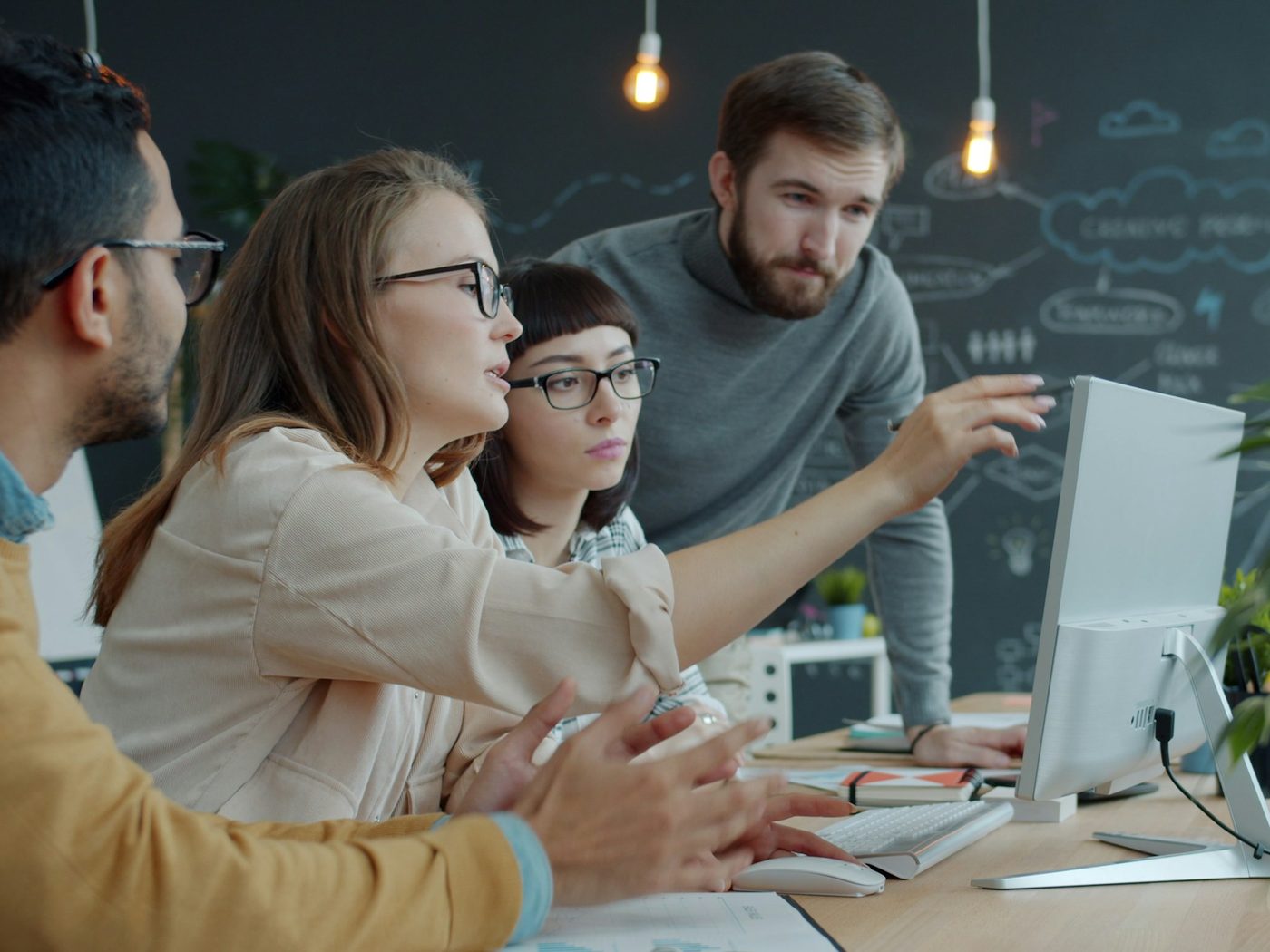A young team working together at a computer
